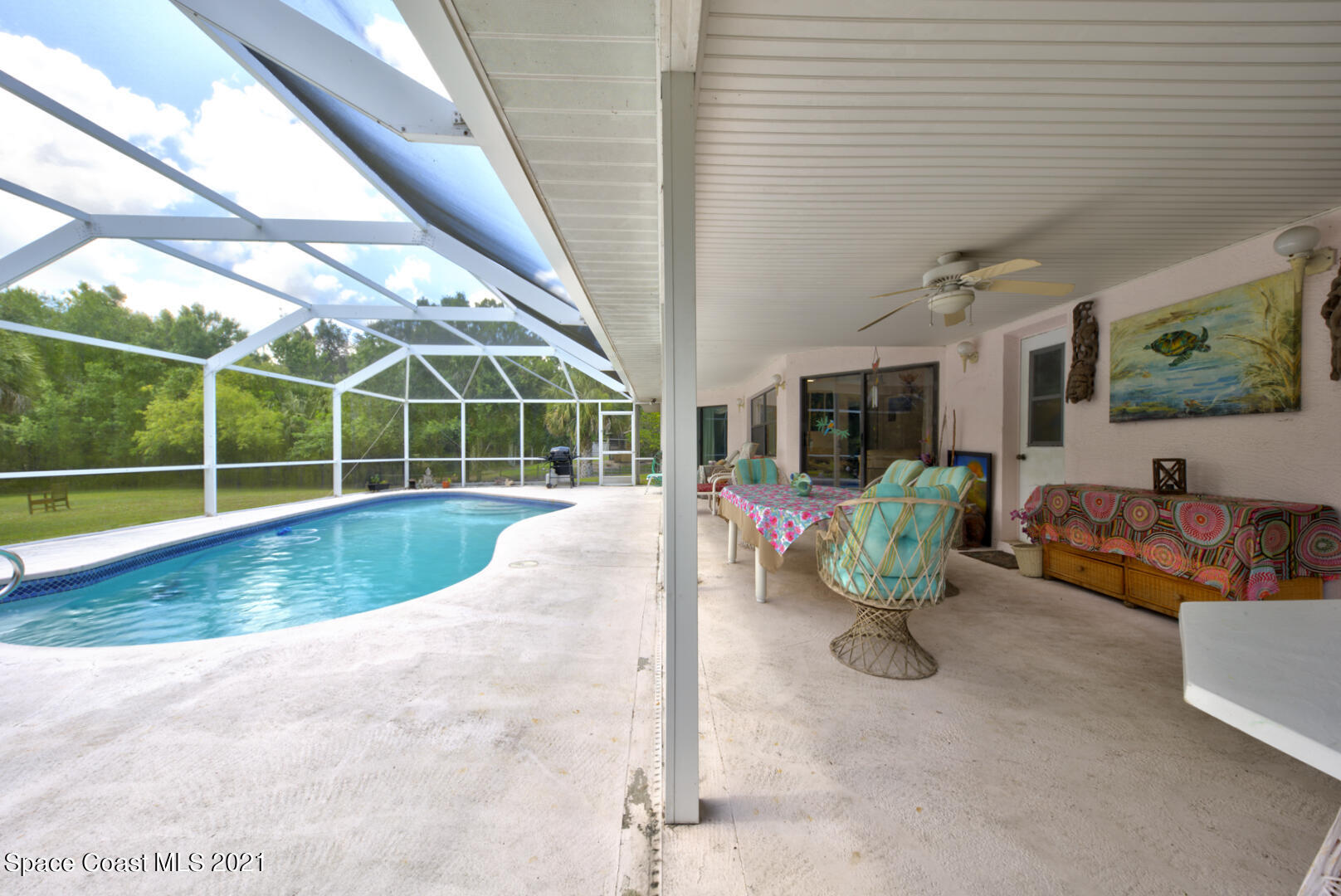 2225 Corey Road Malabar, FL 32950 - Photo 54 of 62 a view of a swimming pool with a patio