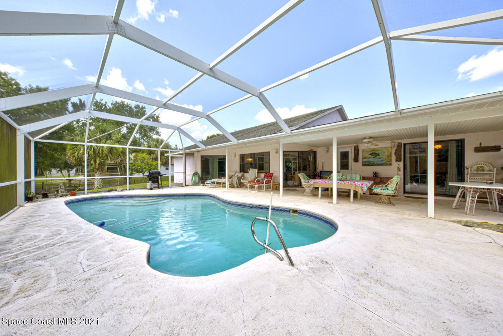 2225 Corey Road Malabar, FL 32950 - Photo 57 of 62 a view of a swimming pool with seating space