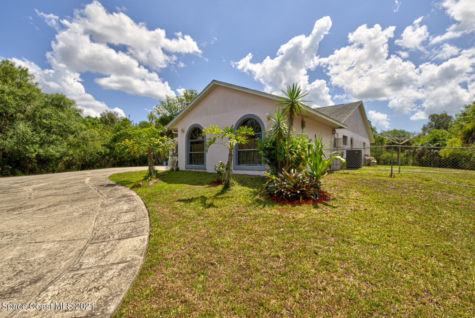 2225 Corey Road Malabar, FL 32950 - Photo 9 of 62 a view of a house with a yard