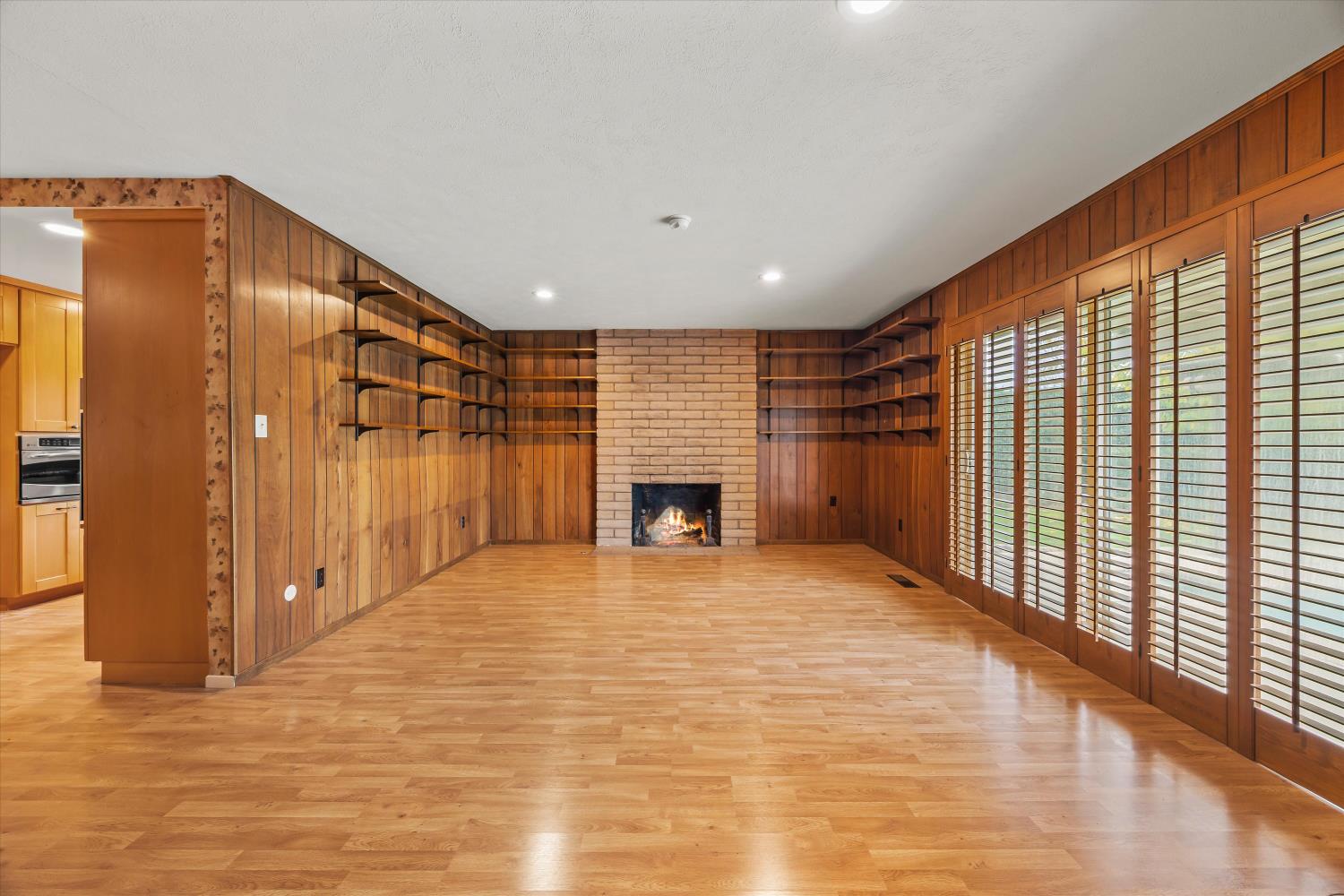 4808 Sherlock Way Carmichael, CA 95608 - Photo 14 of 45 a view of an empty room with a fireplace and a window