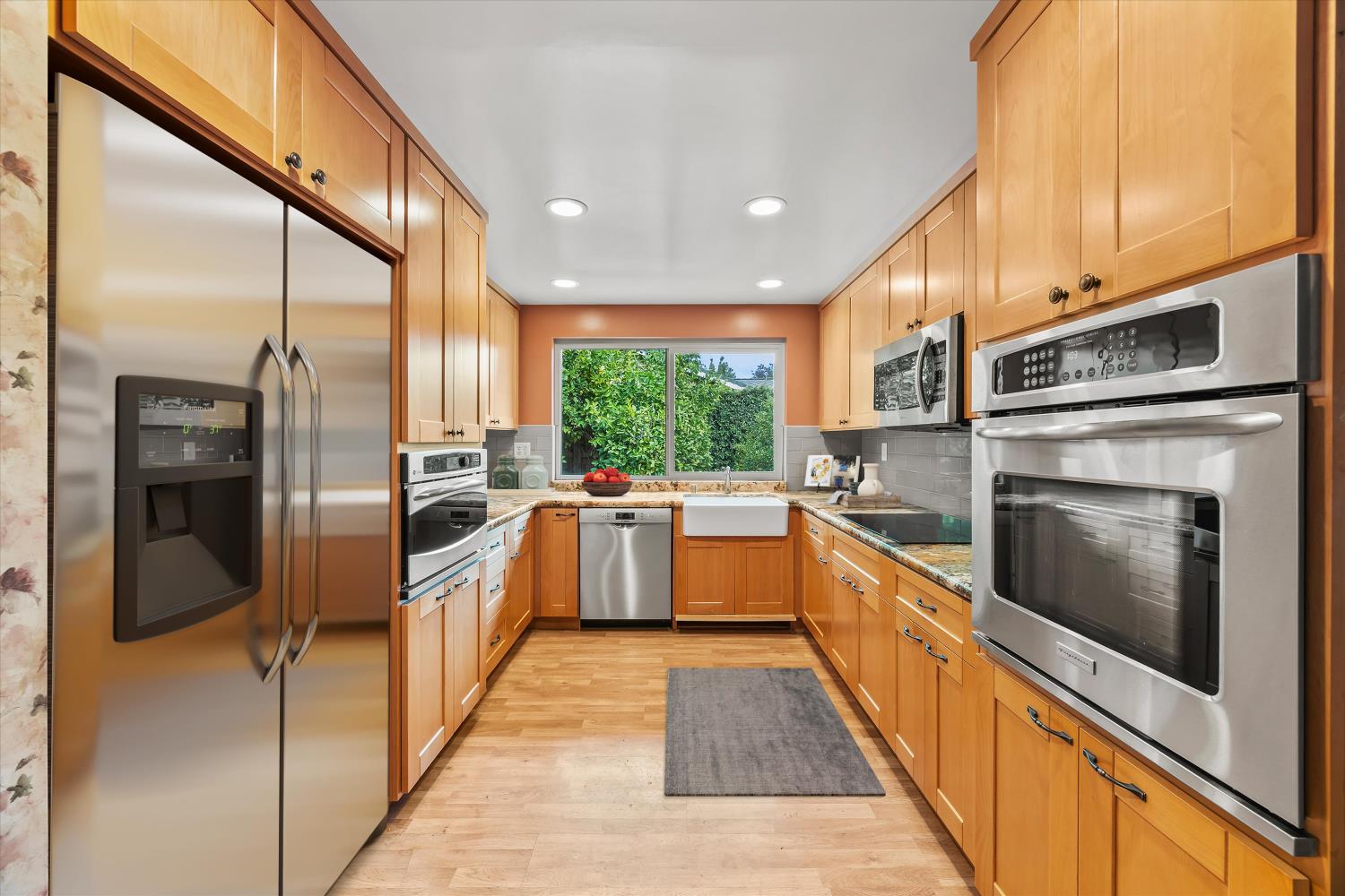 4808 Sherlock Way Carmichael, CA 95608 - Photo 17 of 45 a kitchen with stainless steel appliances a stove top oven a sink and a refrigerator