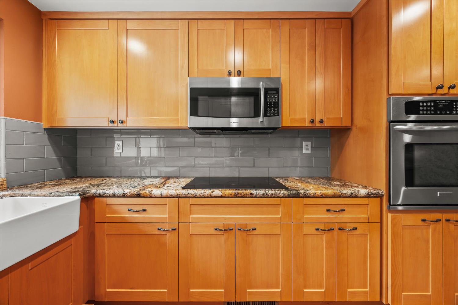 4808 Sherlock Way Carmichael, CA 95608 - Photo 20 of 45 a kitchen with granite countertop cabinets stainless steel appliances and a sink