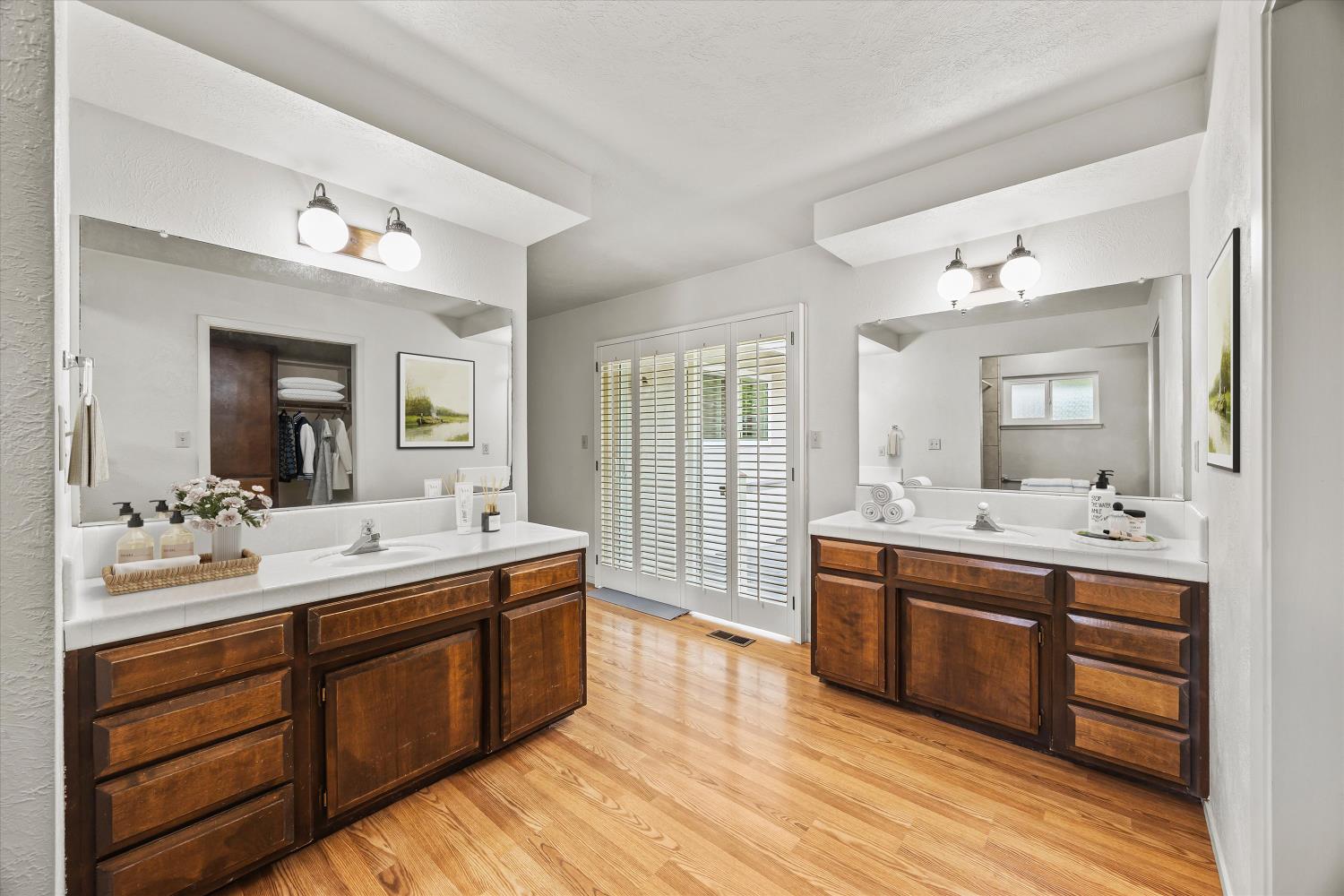 4808 Sherlock Way Carmichael, CA 95608 - Photo 23 of 45 a spacious bathroom with a double vanity sink and a mirror