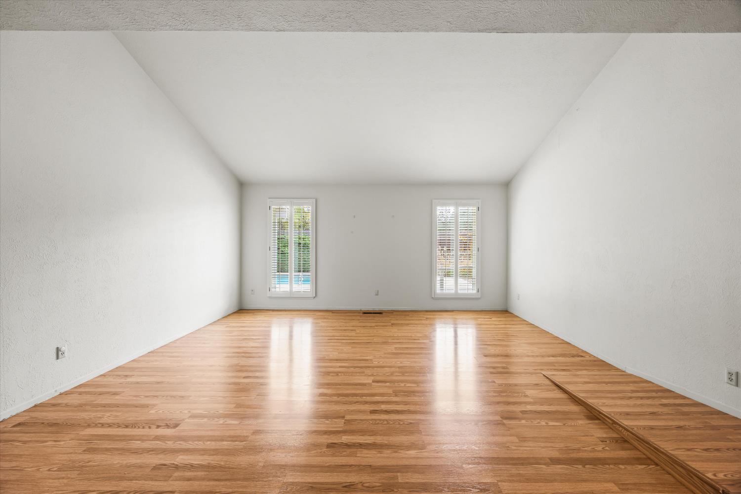 4808 Sherlock Way Carmichael, CA 95608 - Photo 8 of 45 a view of empty room with wooden floor and fan