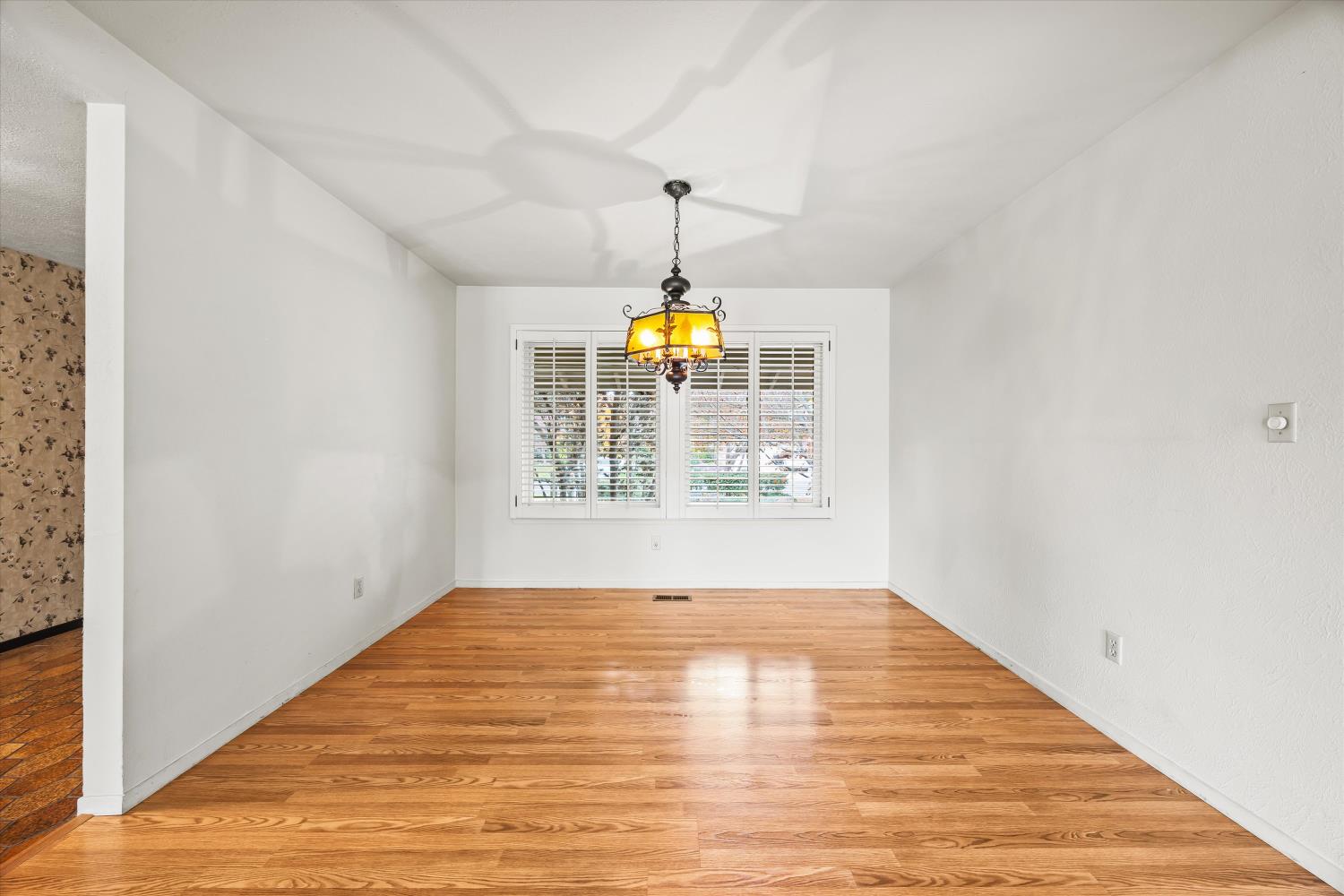 4808 Sherlock Way Carmichael, CA 95608 - Photo 10 of 45 a view of empty room with window and wooden floor