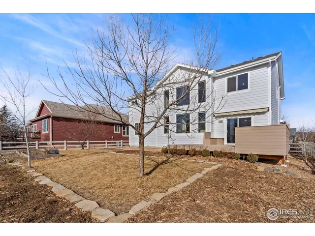 a house view with a wooden fence