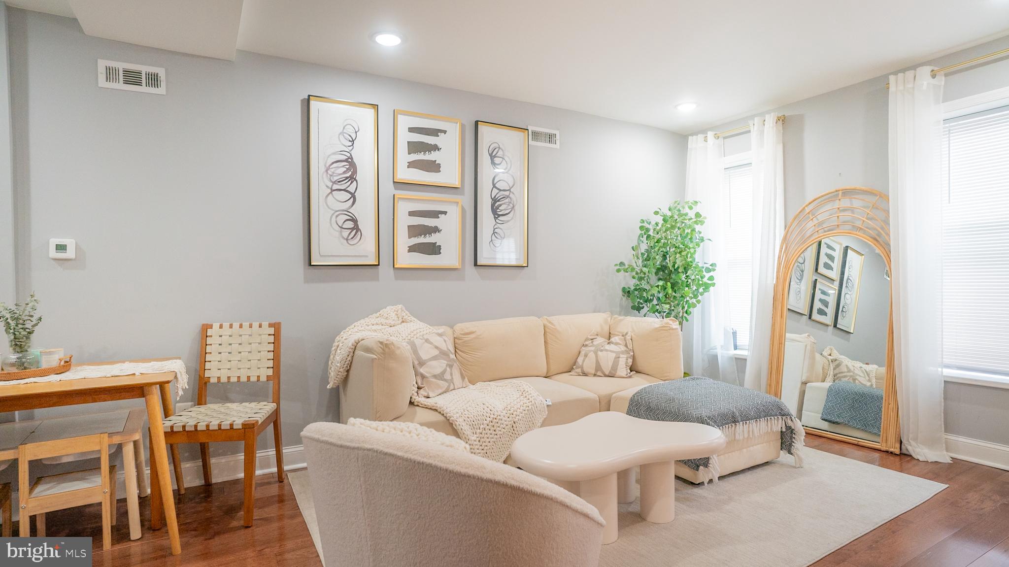 2438 West Seybert Street Philadelphia, PA 19121 - Photo 12 of 21 a living room with furniture and wooden floor