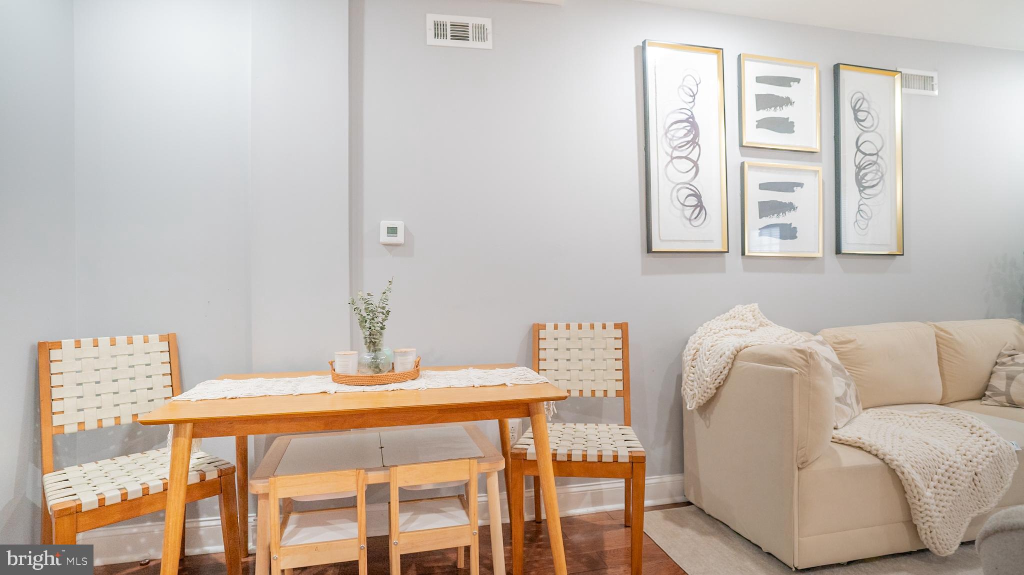 2438 West Seybert Street Philadelphia, PA 19121 - Photo 13 of 21 a dining room with furniture and wooden floor