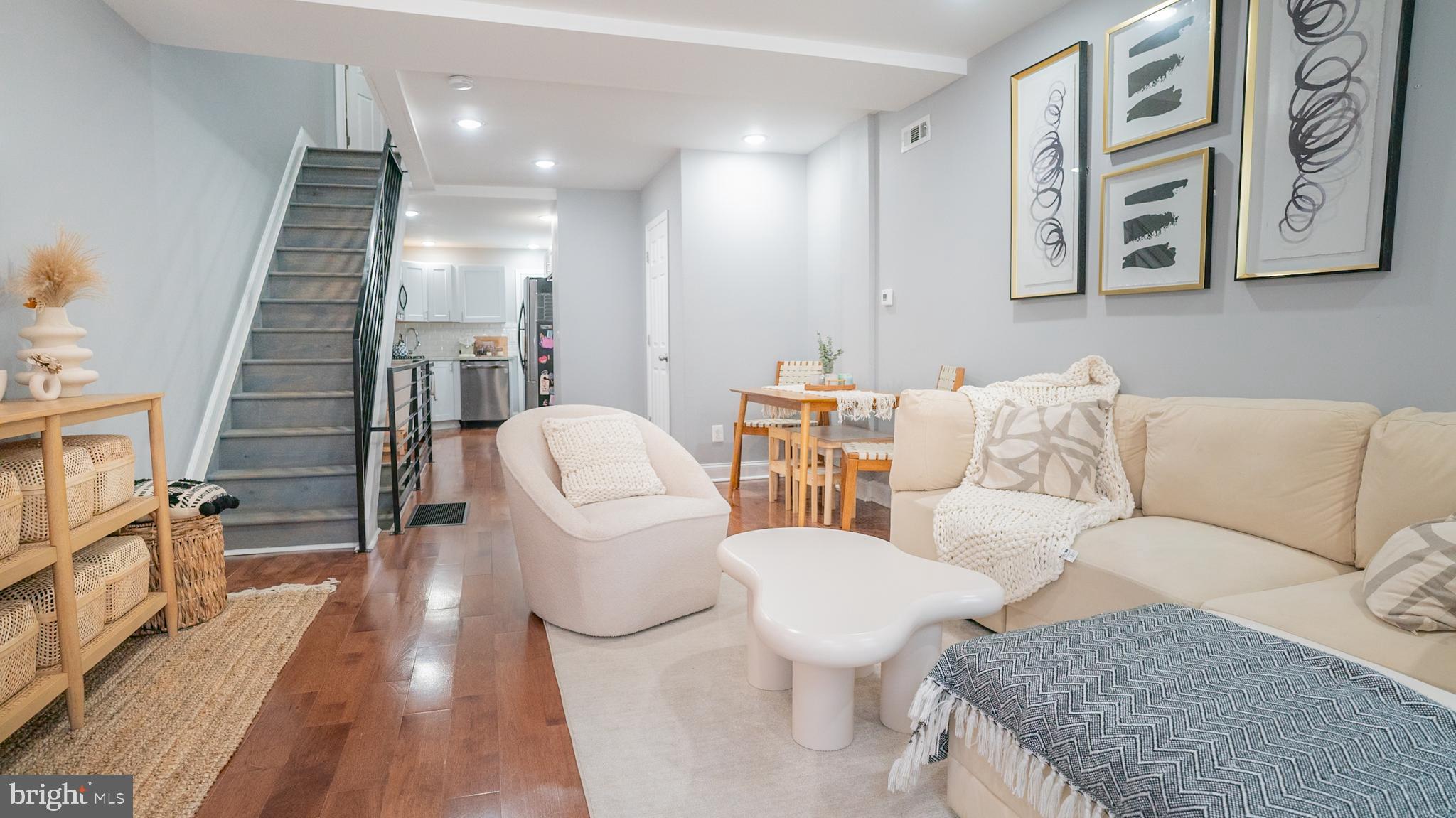 2438 West Seybert Street Philadelphia, PA 19121 - Photo 16 of 21 a living room with furniture and wooden floor