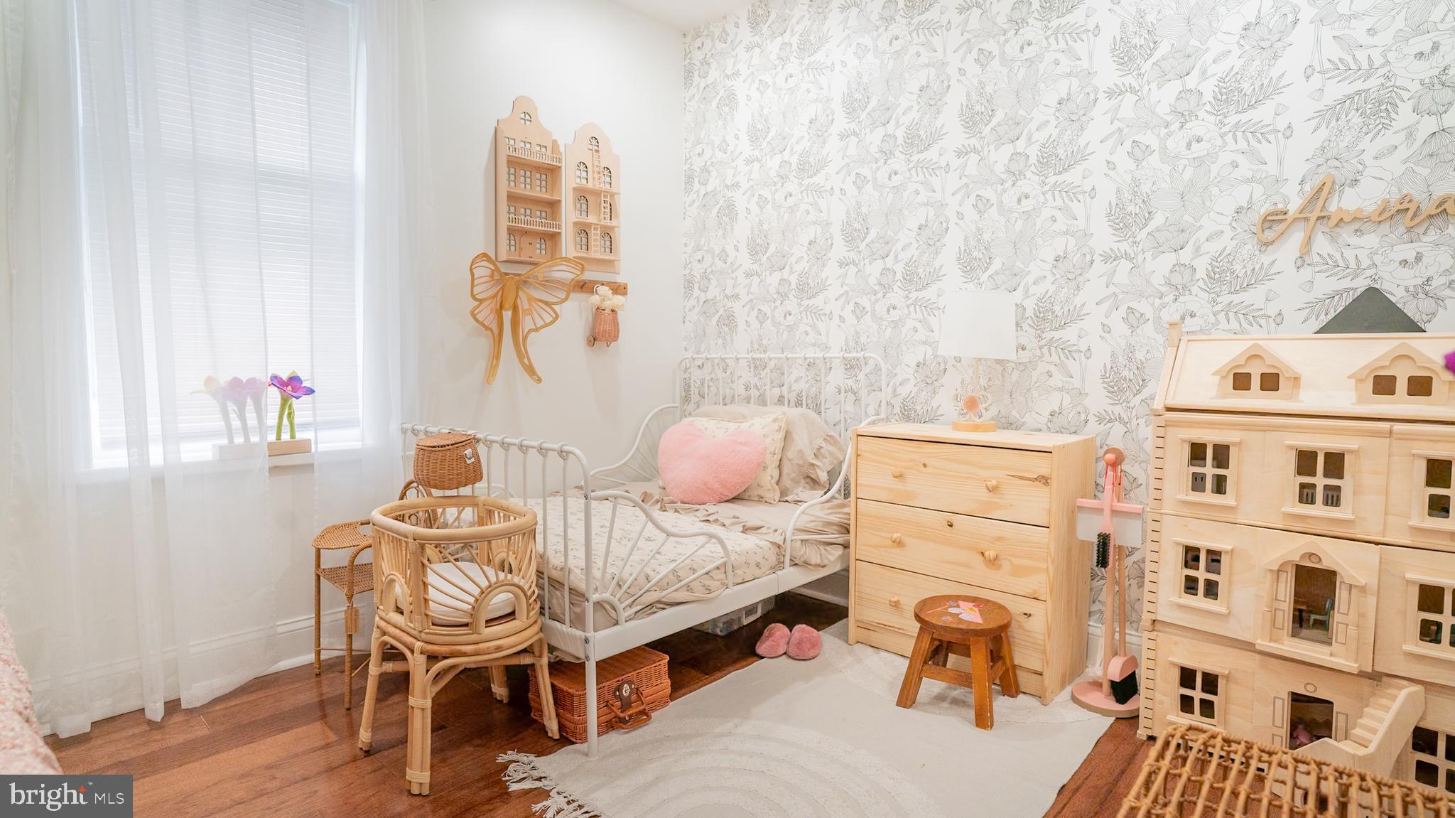 2438 West Seybert Street Philadelphia, PA 19121 - Photo 17 of 21 a bedroom with furniture and a wooden floor