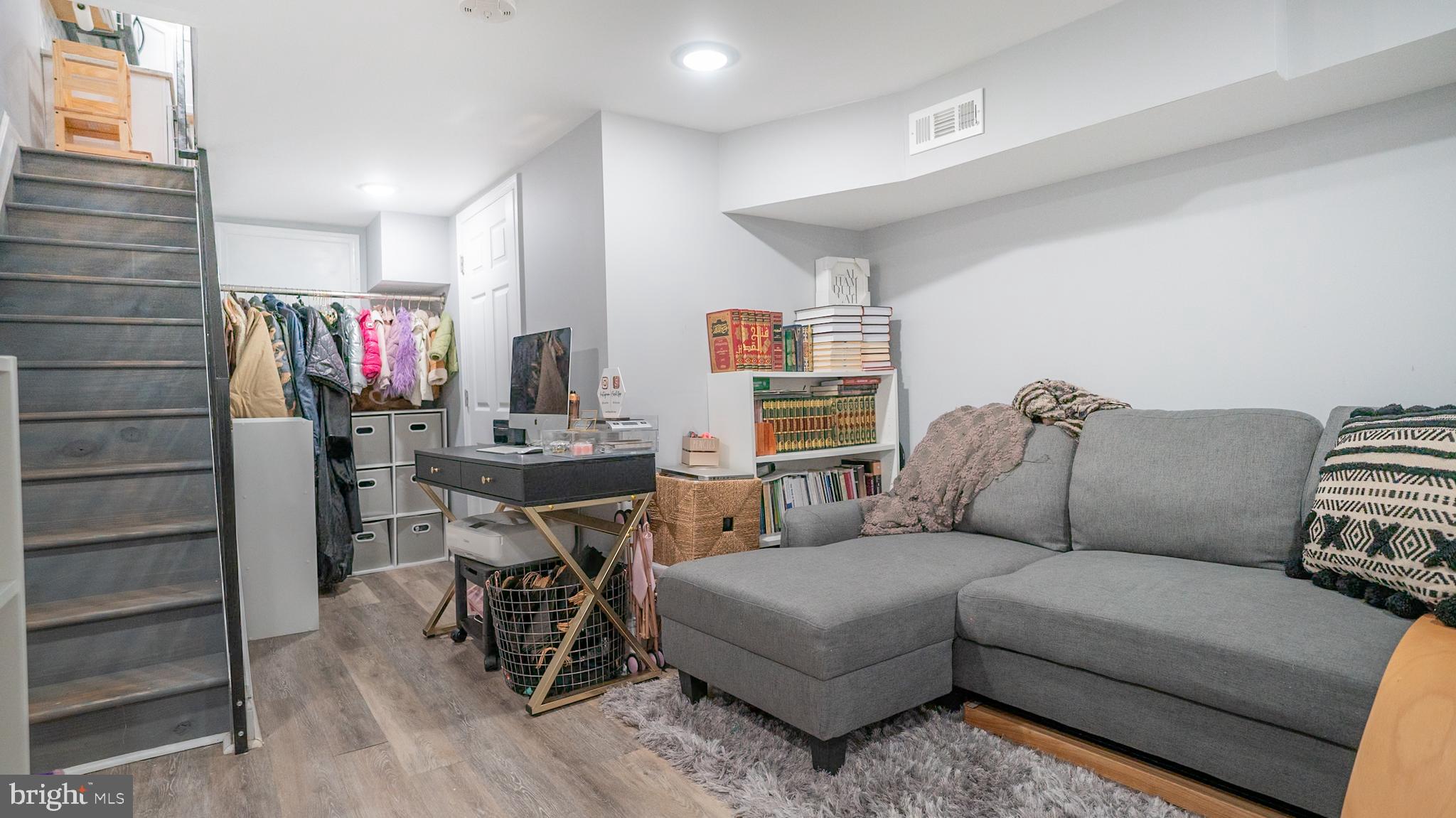 2438 West Seybert Street Philadelphia, PA 19121 - Photo 20 of 21 a living room with furniture and wooden floor