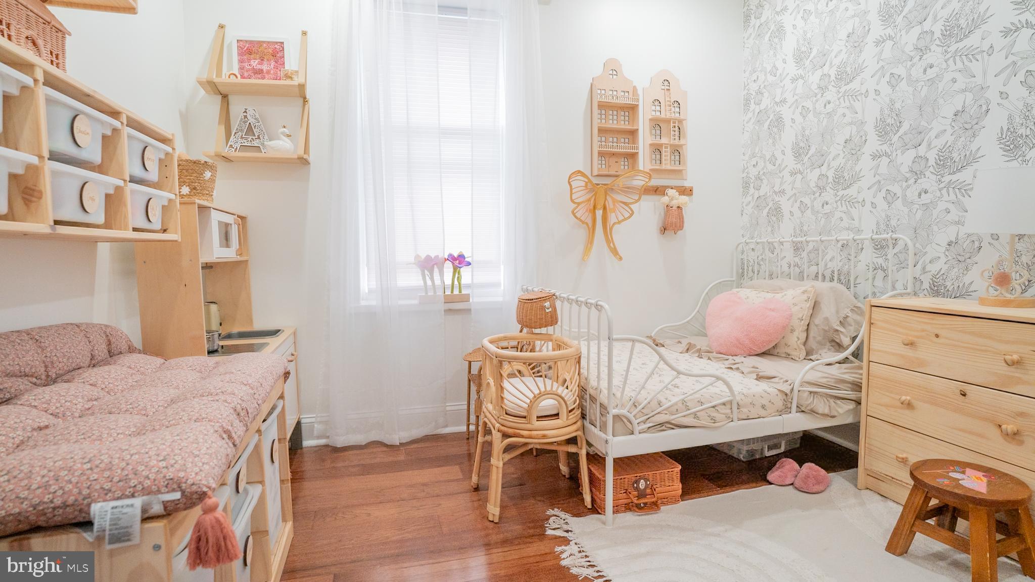 2438 West Seybert Street Philadelphia, PA 19121 - Photo 7 of 21 a bedroom with a bed and a window