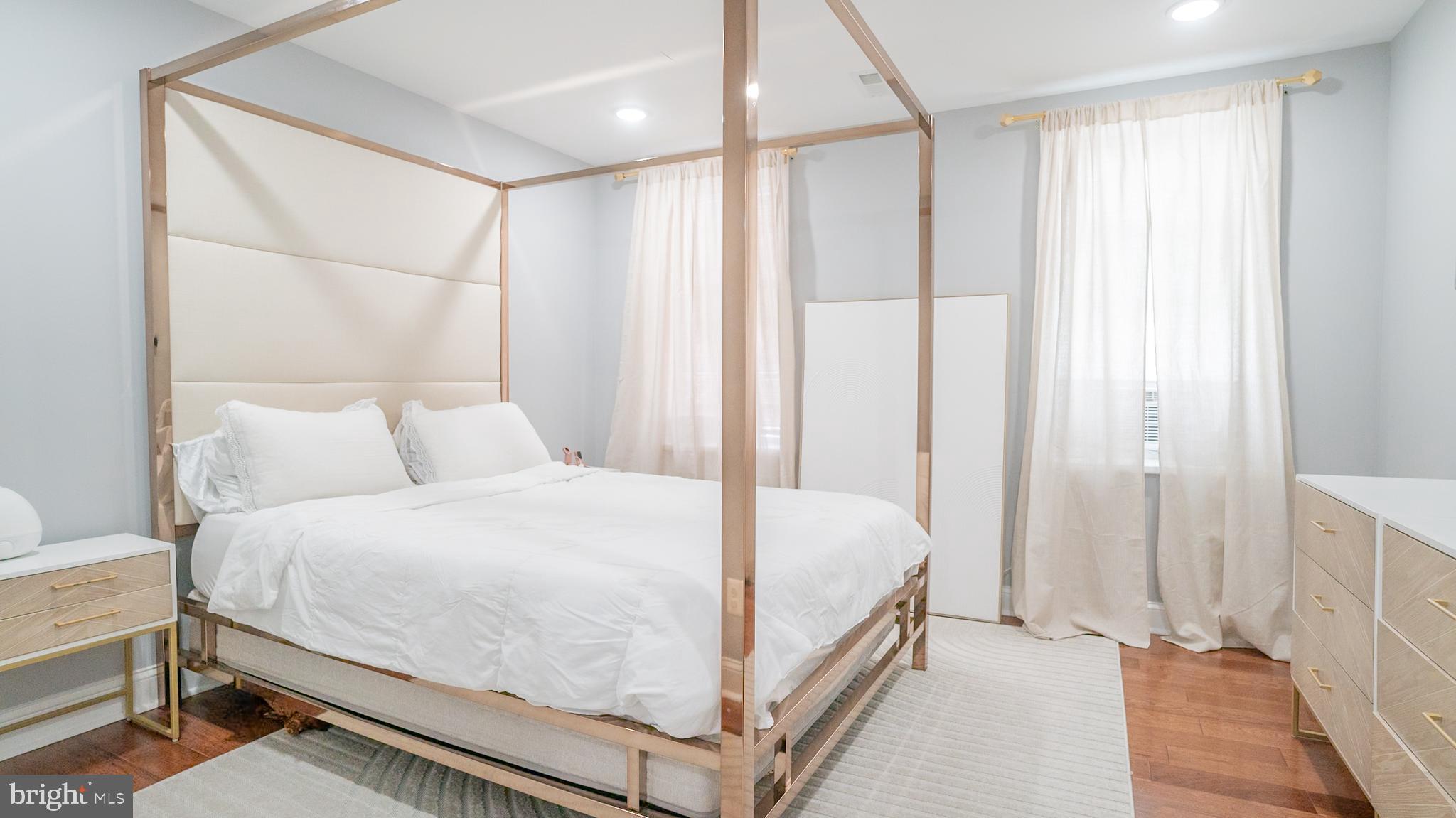 2438 West Seybert Street Philadelphia, PA 19121 - Photo 8 of 21 a bedroom with a bed and a window