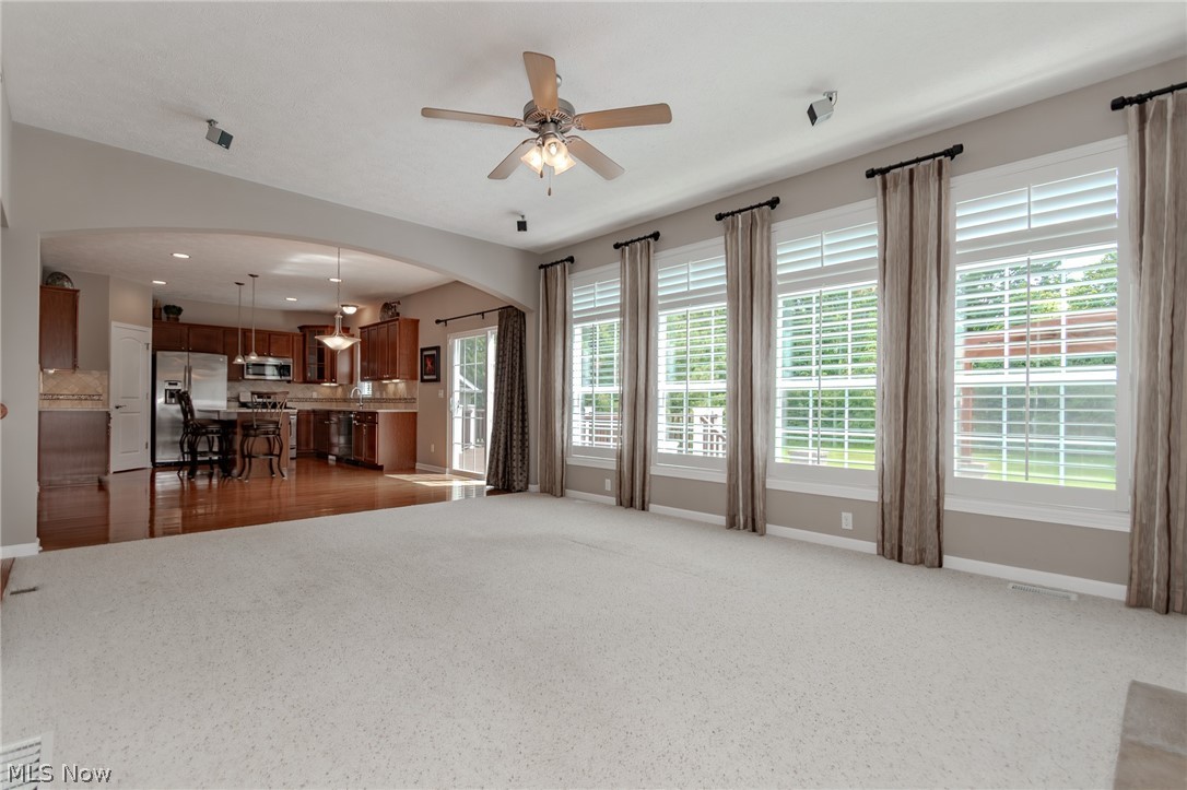 8375 Raleigh Place Painesville, OH 44077 - Photo 20 of 45 Great Room has wall of windows allowing outside views