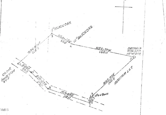 a picture of a room with a white wall and a shower