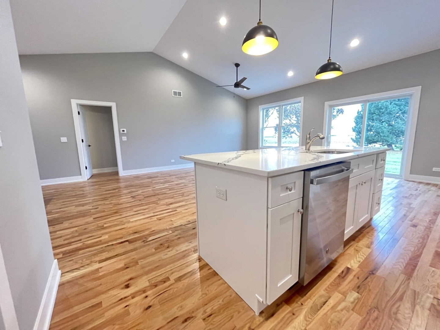 514 Cobblestone Circle Harvard, IL 60033 - Photo 4 of 19 a kitchen with kitchen island granite countertop a sink and a stove
