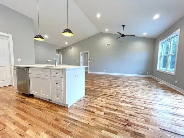 a view of a kitchen and a window