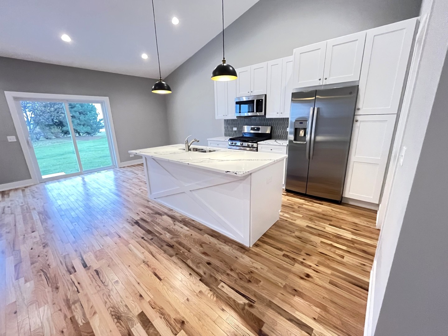514 Cobblestone Circle Harvard, IL 60033 - Photo 8 of 19 a kitchen with kitchen island granite countertop a sink appliances and cabinets