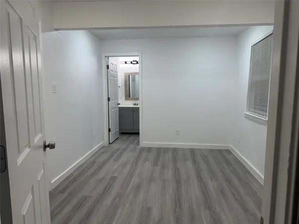 a bathroom with a shower a toilet and a sink