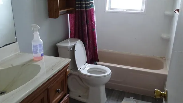 a bathroom with a sink and toilet