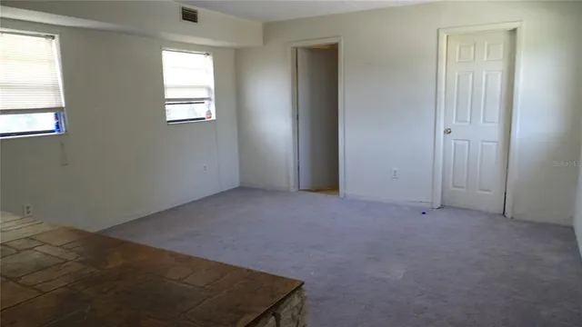an empty room with windows