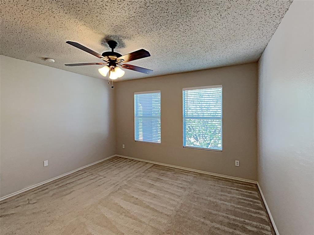 2104 Navada Way Fort Worth, TX 76247 - Photo 8 of 19 wooden floor in an empty room with a window