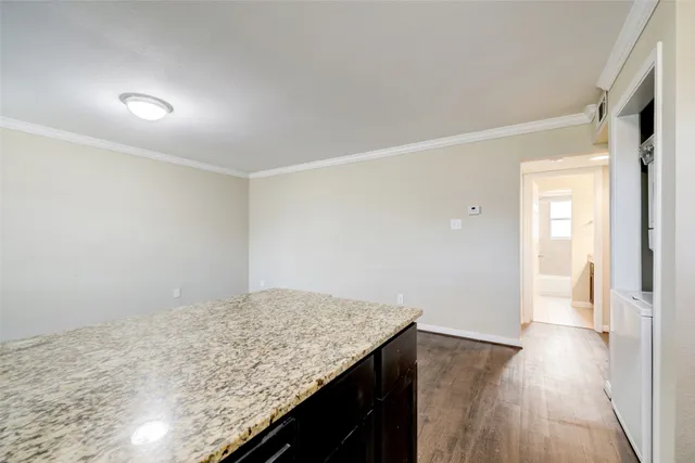 a view of kitchen island with wooden floor