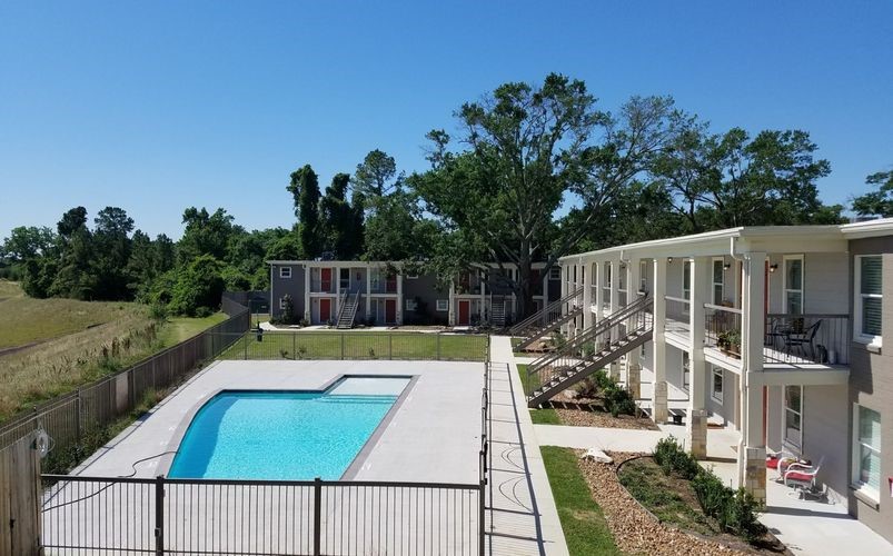 1600 West T C Jester Boulevard, Unit 94 Houston, TX 77008 - Photo 10 of 10 a view of a swimming pool with a patio