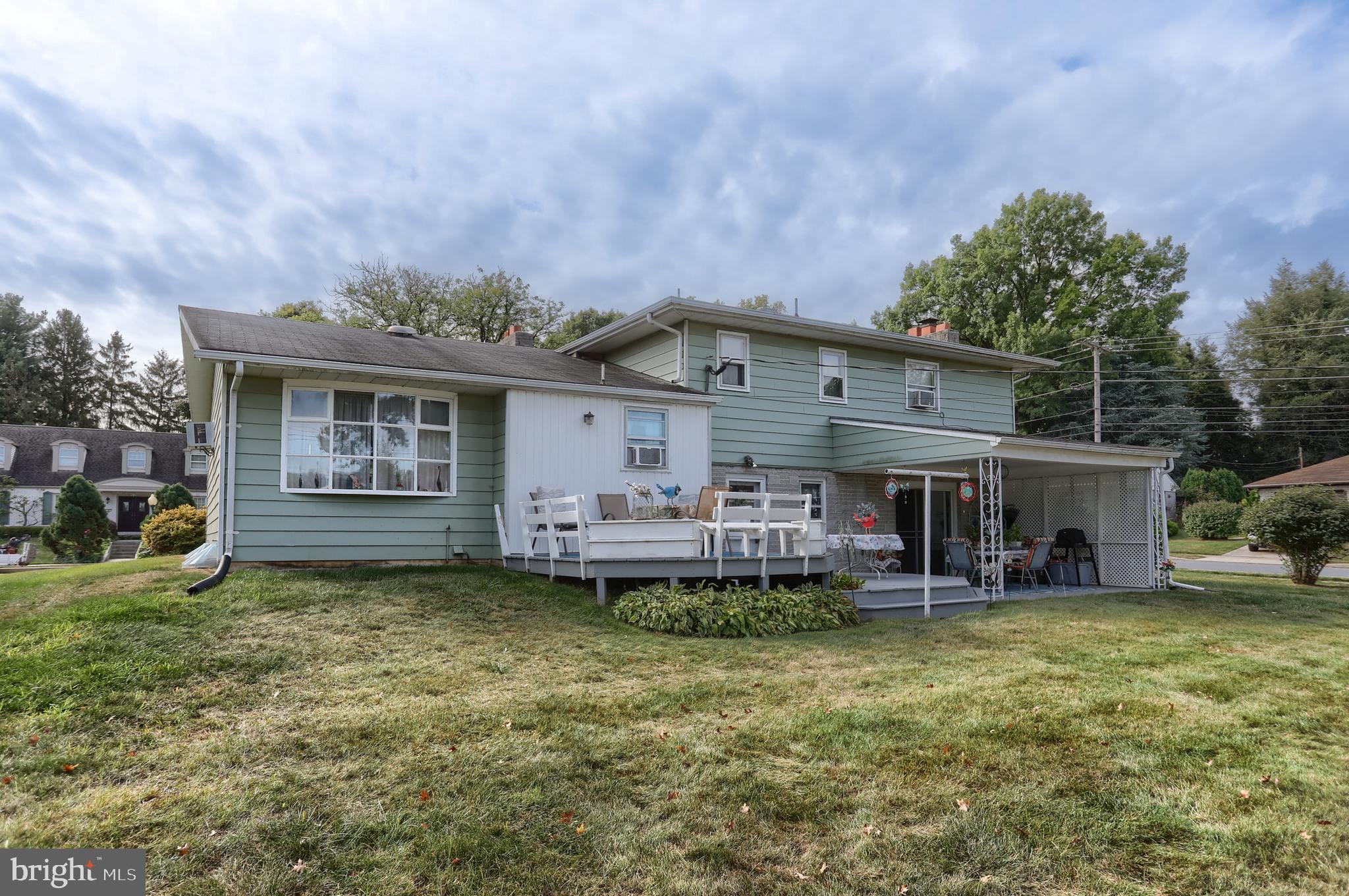 81 Locust Avenue Hershey, PA 17033 - Photo 15 of 18 a view of a house with a yard and sitting area