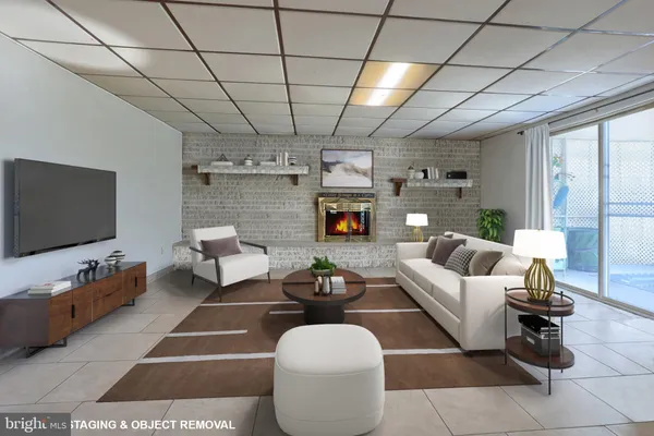 a living room with furniture a flat screen tv and a table
