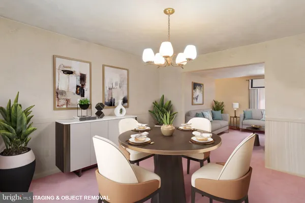 a view of a dining room with furniture wooden floor and chandelier