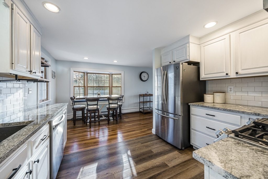55 Lothrop Road Reading, MA 01867 - Photo 11 of 41 a kitchen with stainless steel appliances granite countertop a refrigerator stove microwave and sink