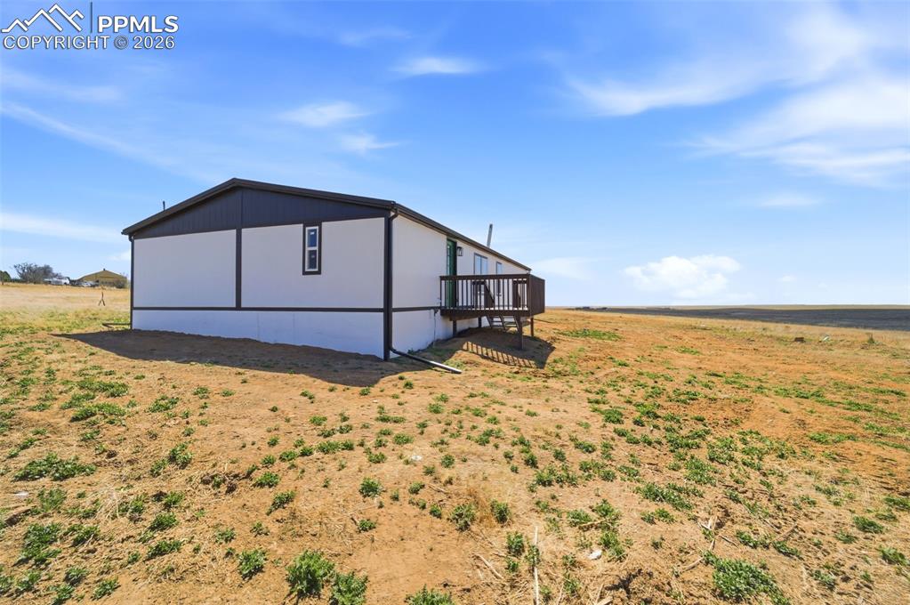 35125 Book Road Yoder, CO 80864 - Photo 41 of 45 a front view of a house with a yard