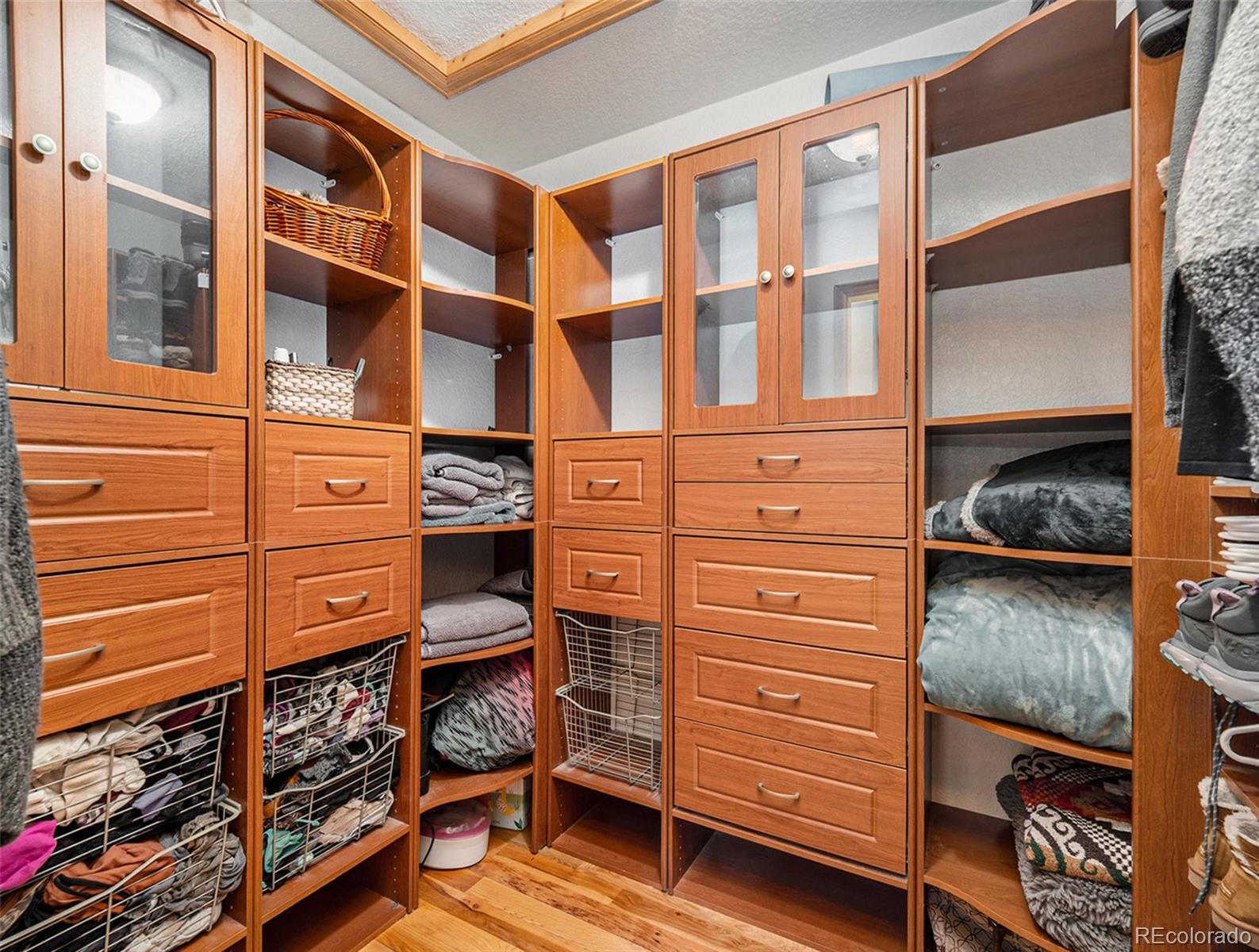11748 Apache Trail Conifer, CO 80433 - Photo 15 of 34 a view of walk in closet with clothes and shoes