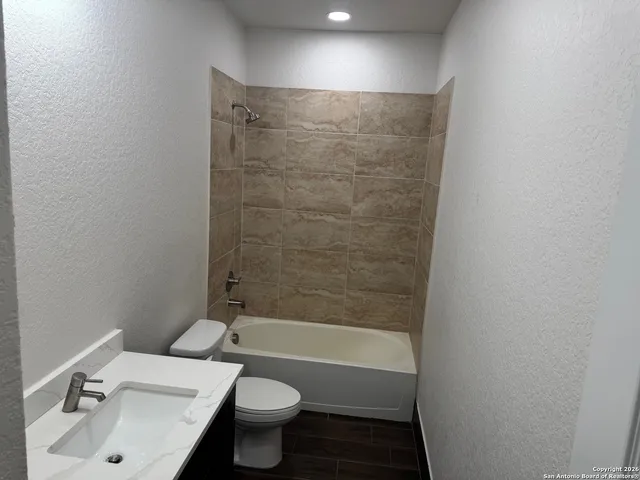 a bathroom with a sink and a toilet