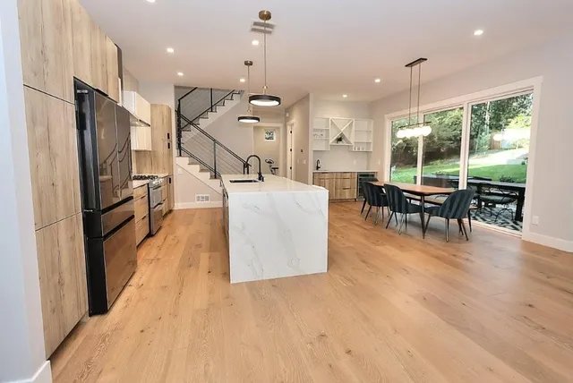 a kitchen with a sink a counter space and appliances