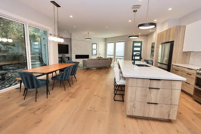 a dining room with furniture and wooden floor