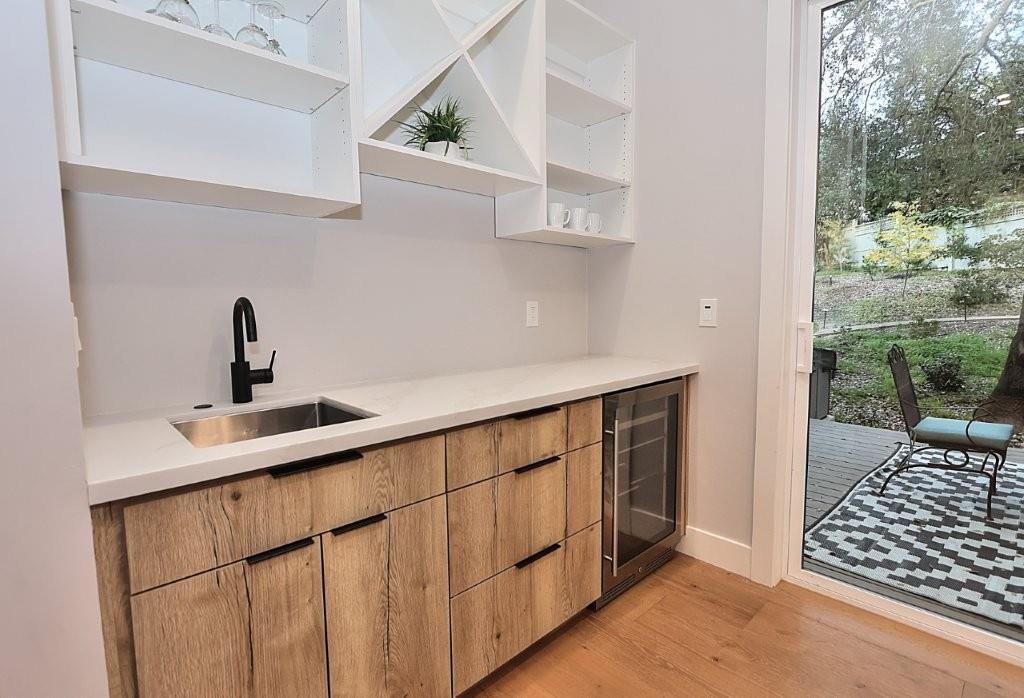 4014 Capitola Hills Court Fair Oaks, CA 95628 - Photo 21 of 59 a kitchen with a sink and cabinets