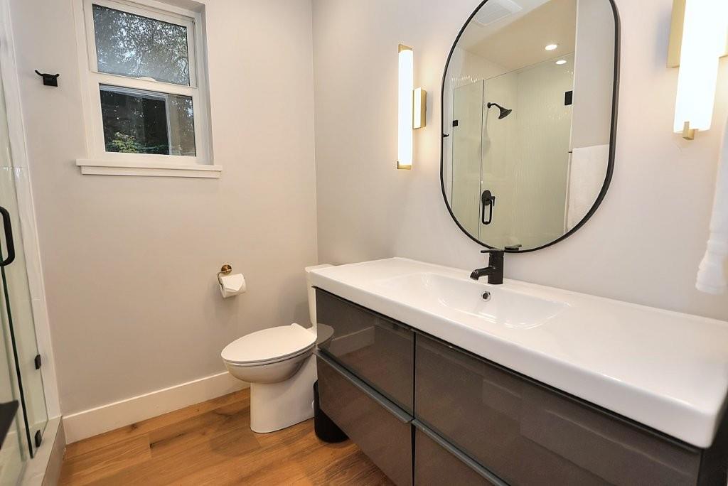 4014 Capitola Hills Court Fair Oaks, CA 95628 - Photo 22 of 59 a bathroom with a toilet sink and mirror