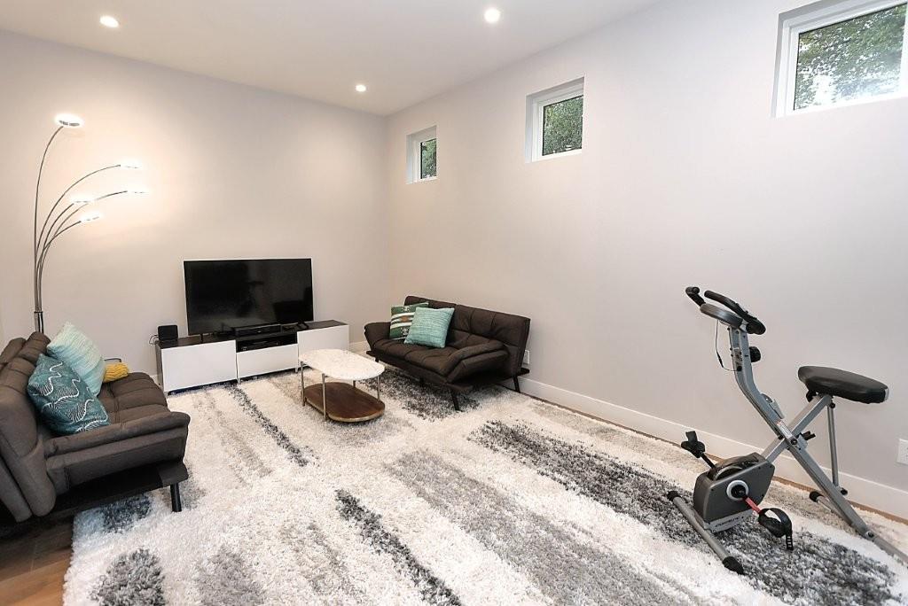 4014 Capitola Hills Court Fair Oaks, CA 95628 - Photo 24 of 59 a bedroom with a bed a couch and a flat screen tv