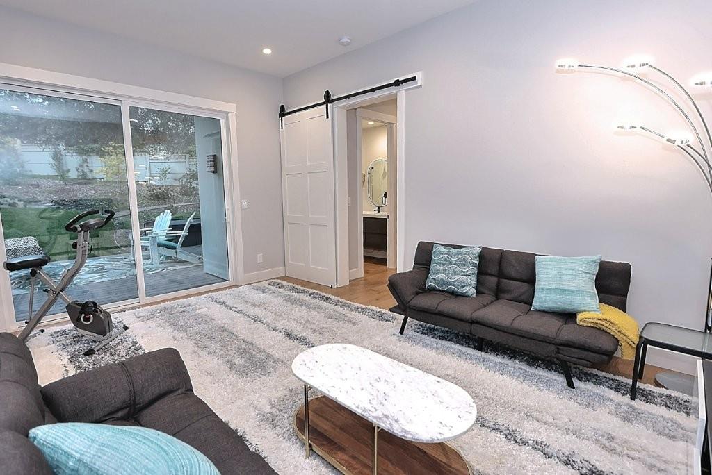 4014 Capitola Hills Court Fair Oaks, CA 95628 - Photo 26 of 59 a living room with furniture and a large window