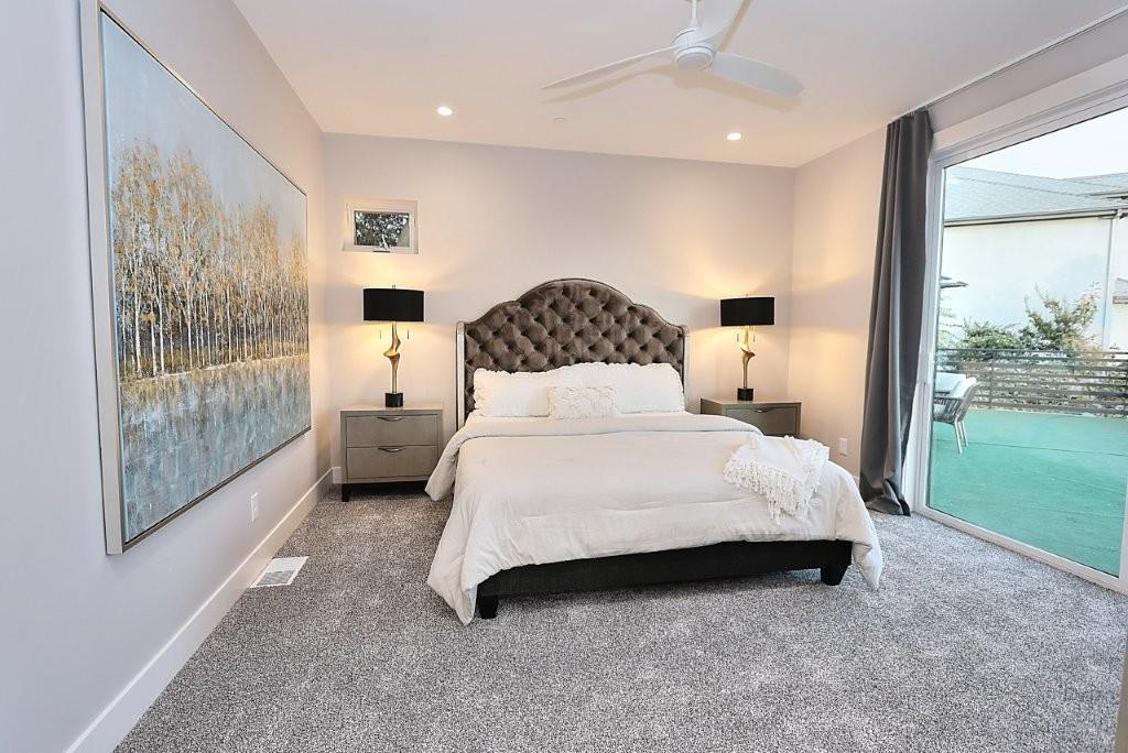 4014 Capitola Hills Court Fair Oaks, CA 95628 - Photo 28 of 59 a bedroom with a bed and large window