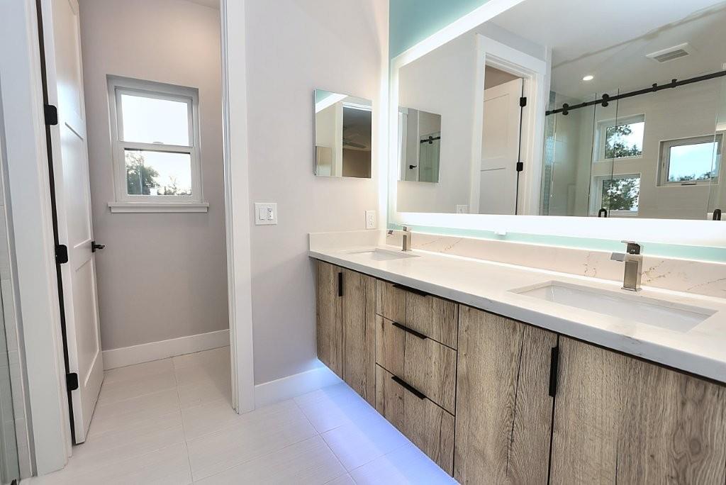 4014 Capitola Hills Court Fair Oaks, CA 95628 - Photo 33 of 59 a bathroom with a double vanity sink and mirror