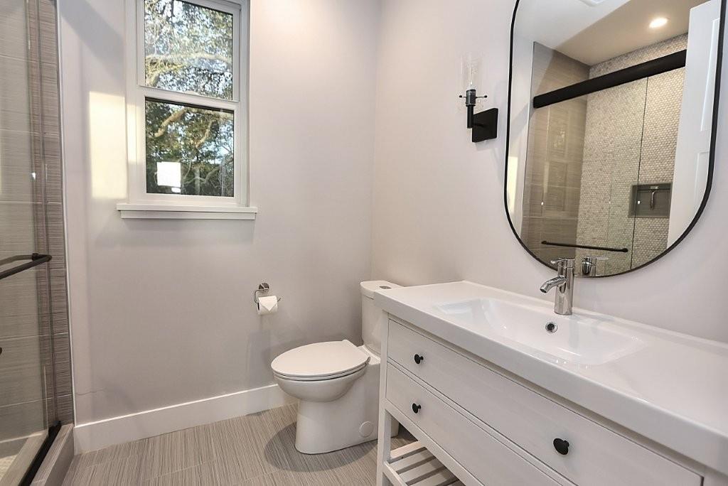 4014 Capitola Hills Court Fair Oaks, CA 95628 - Photo 37 of 59 a bathroom with a toilet a sink and mirror