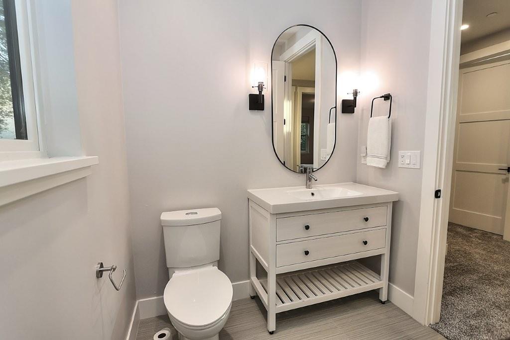 4014 Capitola Hills Court Fair Oaks, CA 95628 - Photo 38 of 59 a bathroom with a toilet a sink and mirror