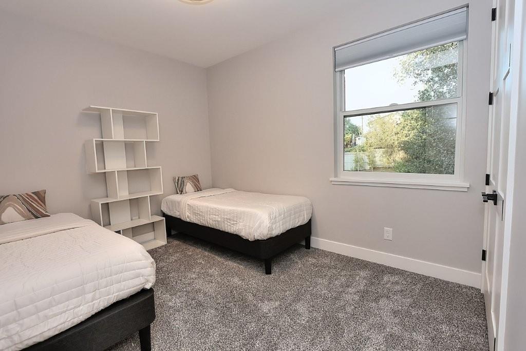 4014 Capitola Hills Court Fair Oaks, CA 95628 - Photo 39 of 59 a spacious bedroom with two beds and a window