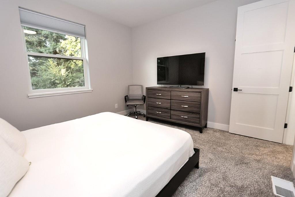 4014 Capitola Hills Court Fair Oaks, CA 95628 - Photo 40 of 59 a bedroom with a bed and a flat screen tv