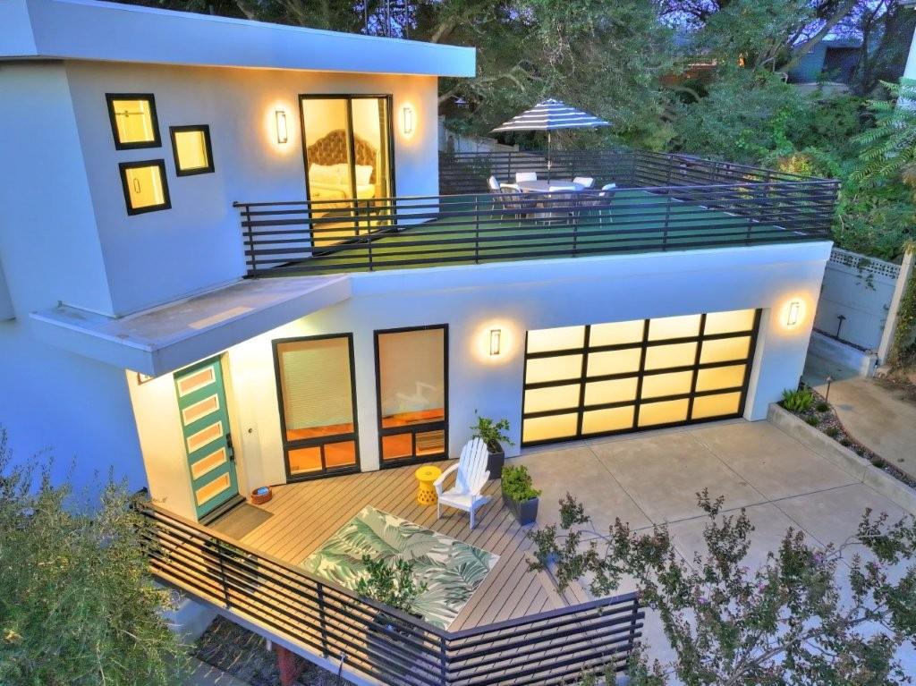 4014 Capitola Hills Court Fair Oaks, CA 95628 - Photo 5 of 59 a front view of a house with large windows