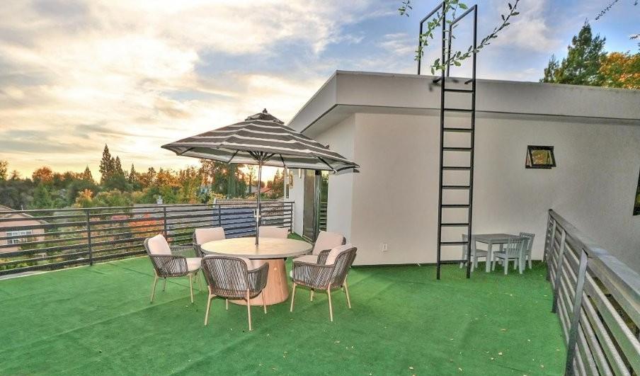 4014 Capitola Hills Court Fair Oaks, CA 95628 - Photo 52 of 59 a backyard of a house with table and chairs