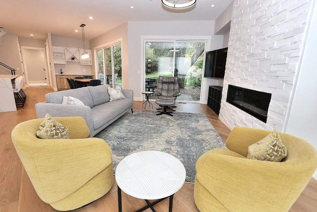 4014 Capitola Hills Court Fair Oaks, CA 95628 - Photo 7 of 59 a living room with furniture a flat screen tv and a fireplace